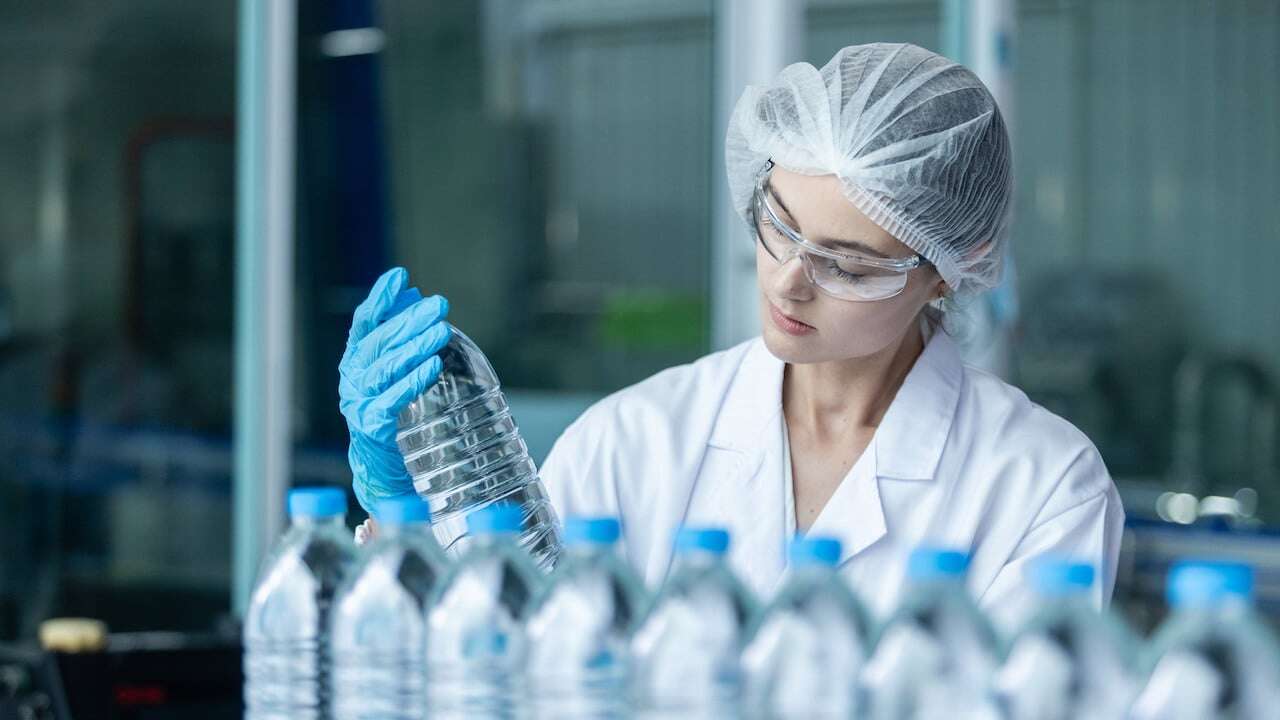 A CPG worker inspecting products 