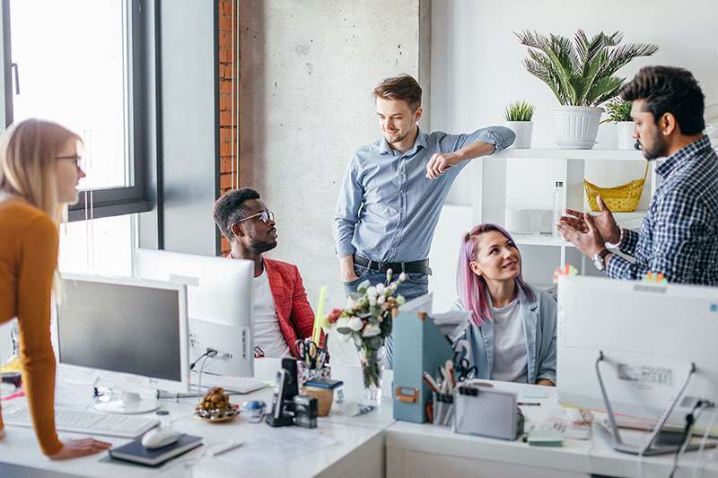 employees in the office talking