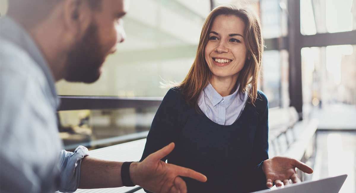 woman collaborating ideas with her co-worker